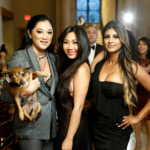 Photo of friends posing for the camera at the 2022 Houston Emancipet gala